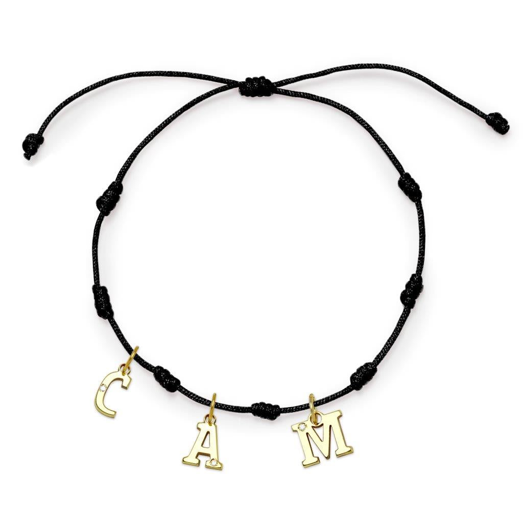 Pulsera con Inicial 7 nudos Negro 3 letras con Diamante y Oro